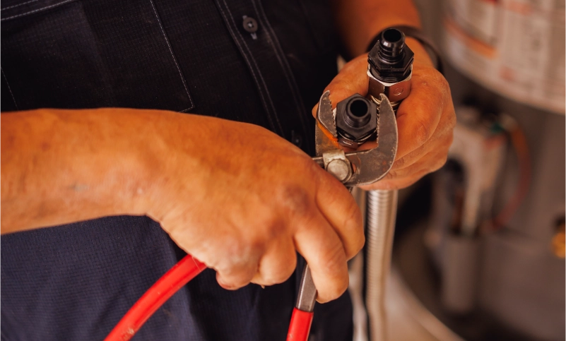 tech working on plumbing